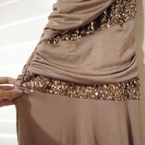 Floor length one shoulder gold gown with gold sequin